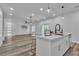 Bright kitchen features stainless steel appliances, a breakfast bar, and an open view to the living room at 600 N Carriage Hill Dr # 1164, Las Vegas, NV 89138