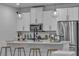 Modern kitchen featuring white cabinets, stainless steel appliances, and pendant lighting at 600 N Carriage Hill Dr # 1164, Las Vegas, NV 89138