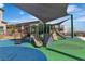 Community playground featuring slides, climbing structures, and shaded areas for enjoyment at 600 N Carriage Hill Dr # 1164, Las Vegas, NV 89138