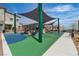 Community playground featuring slides, climbing structures, and shaded areas for enjoyment at 600 N Carriage Hill Dr # 1164, Las Vegas, NV 89138