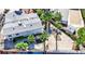 An aerial view showcases this home's unique roofline, backyard, and proximity to lush green trees at 6710 Redwood Cir, Las Vegas, NV 89103