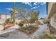 Large backyard showcasing garden beds, patio area, and mature landscaping at 6710 Redwood Cir, Las Vegas, NV 89103
