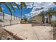 Extensive backyard with mature palm trees and a spacious concrete patio area at 6710 Redwood Cir, Las Vegas, NV 89103