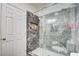 Nicely tiled bathroom with glass enclosed shower and updated fixtures at 6710 Redwood Cir, Las Vegas, NV 89103