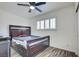 Bedroom features a large dark wood bed frame, wood-look floors, and a bright window at 6710 Redwood Cir, Las Vegas, NV 89103