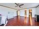 Bright, spacious bedroom featuring hardwood floors and multiple access doors at 6710 Redwood Cir, Las Vegas, NV 89103
