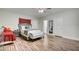 Light-filled bedroom featuring two beds, ceiling fan, with wood floors at 6710 Redwood Cir, Las Vegas, NV 89103