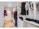 Spacious walk-in closet with custom shelving and storage for clothes and accessories at 6710 Redwood Cir, Las Vegas, NV 89103