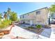 Charming two-story home with a well-kept front yard, planters and landscaping at 6710 Redwood Cir, Las Vegas, NV 89103