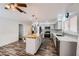 Bright kitchen featuring stainless appliances, stylish island with seating, and modern light fixtures at 6710 Redwood Cir, Las Vegas, NV 89103