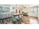 Bright kitchen featuring stainless appliances, stylish island with seating and modern light fixtures at 6710 Redwood Cir, Las Vegas, NV 89103