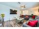 Spacious living room with ample seating, large television, and modern decor at 6710 Redwood Cir, Las Vegas, NV 89103