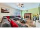 Cozy living room features a brick fireplace, plush seating, and lots of natural light at 6710 Redwood Cir, Las Vegas, NV 89103