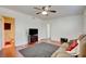 Living room featuring neutral colors, wood floors, with an adjacent bathroom at 6710 Redwood Cir, Las Vegas, NV 89103