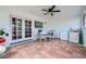 Enclosed patio with ceiling fan, tile flooring, table and chairs, and laundry appliances at 6710 Redwood Cir, Las Vegas, NV 89103