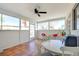 Bright sun room with tile floors, a ceiling fan, and large windows overlooking the yard at 6710 Redwood Cir, Las Vegas, NV 89103