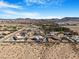 Aerial view of a rural desert community with mountains in the distance at 78 Siddall Ave, Las Vegas, NV 89183