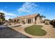 Backyard features a pool, spa, artificial grass, and ample patio space for entertaining in style at 78 Siddall Ave, Las Vegas, NV 89183