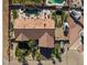 Birds eye view of backyard with inground pool, desert landscaping, RV parking, and lush greenery at 78 Siddall Ave, Las Vegas, NV 89183
