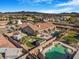 Birds eye view of backyard with pool, spa, luscious lawn, RV parking, and desert landscaping at 78 Siddall Ave, Las Vegas, NV 89183