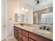 Bathroom with a double sink vanity and granite countertops at 78 Siddall Ave, Las Vegas, NV 89183