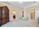 Spacious bedroom showcasing multiple doorways and light green lounge chair at 78 Siddall Ave, Las Vegas, NV 89183
