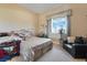 Cozy bedroom with neutral tones, window views, and comfortable seating at 78 Siddall Ave, Las Vegas, NV 89183
