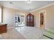 Bedroom with large armoire, neutral tones, and slider to exterior at 78 Siddall Ave, Las Vegas, NV 89183