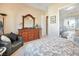 Bedroom with dresser, mirror, and a comfortable seating area at 78 Siddall Ave, Las Vegas, NV 89183