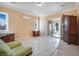 Bedroom with ample natural light, a large armoire, and slider to exterior at 78 Siddall Ave, Las Vegas, NV 89183