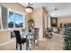 Bright breakfast nook with glass-top dining table, lots of windows and easy access to living room at 78 Siddall Ave, Las Vegas, NV 89183