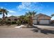 Inviting home with palm trees and a three car garage at 78 Siddall Ave, Las Vegas, NV 89183