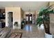 Inviting foyer with double door entry, tiled floors, and a view of the living spaces at 78 Siddall Ave, Las Vegas, NV 89183