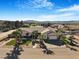 Charming home featuring a well-manicured front yard with palm trees and beautiful mountain views at 78 Siddall Ave, Las Vegas, NV 89183