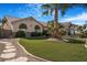 Charming single-story home featuring a well-maintained lawn, stone accents, and a desert-friendly landscape at 78 Siddall Ave, Las Vegas, NV 89183
