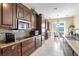 Gourmet kitchen with stainless steel appliances and granite countertops at 78 Siddall Ave, Las Vegas, NV 89183