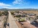 View of the neighborhood with houses, desert landscaping, mountain views, and clear blue skies at 78 Siddall Ave, Las Vegas, NV 89183