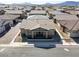 Stunning aerial view of a single-story home showcasing desert landscaping in a neatly planned community at 783 Hibiscuss Blossom St, Henderson, NV 89011