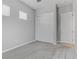 Clean bedroom featuring carpet floors, a spacious closet with sliding doors, and two windows at 783 Hibiscuss Blossom St, Henderson, NV 89011