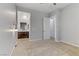 Spacious bedroom with carpet flooring, modern lighting, and an ensuite bathroom visible through the doorway at 783 Hibiscuss Blossom St, Henderson, NV 89011