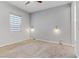 Bright bedroom featuring neutral walls, a ceiling fan, sconce lighting, and a window for natural light at 783 Hibiscuss Blossom St, Henderson, NV 89011