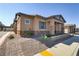 Exterior view with neutral stucco, stone accents, and desert landscaping at 783 Hibiscuss Blossom St, Henderson, NV 89011