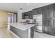 Modern kitchen with granite countertops, stainless steel appliances, and dark cabinetry with ample storage space at 783 Hibiscuss Blossom St, Henderson, NV 89011