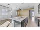 Spacious, open-concept floor plan showcasing the kitchen with a large island and stainless steel appliances at 783 Hibiscuss Blossom St, Henderson, NV 89011