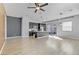 Spacious open living area with hardwood floors, modern kitchen, island, and abundant natural light at 783 Hibiscuss Blossom St, Henderson, NV 89011