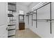 Walk-in closet with shelving, drawers, and hanging rods for organized storage solutions at 783 Hibiscuss Blossom St, Henderson, NV 89011