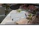 Aerial view of a home with a large roof and front yard, surrounded by lush landscaping and mature trees at 904 Hibiscus Ct, Henderson, NV 89011