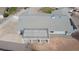Birds-eye view of a home with a large rooftop patio, neutral toned roof tiles, and a spacious driveway at 904 Hibiscus Ct, Henderson, NV 89011