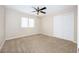 Cozy bedroom with neutral carpeting, a ceiling fan, and double doors to a closet at 904 Hibiscus Ct, Henderson, NV 89011
