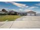 Expansive single story house features desert landscaping, long driveway and two car garage at 904 Hibiscus Ct, Henderson, NV 89011